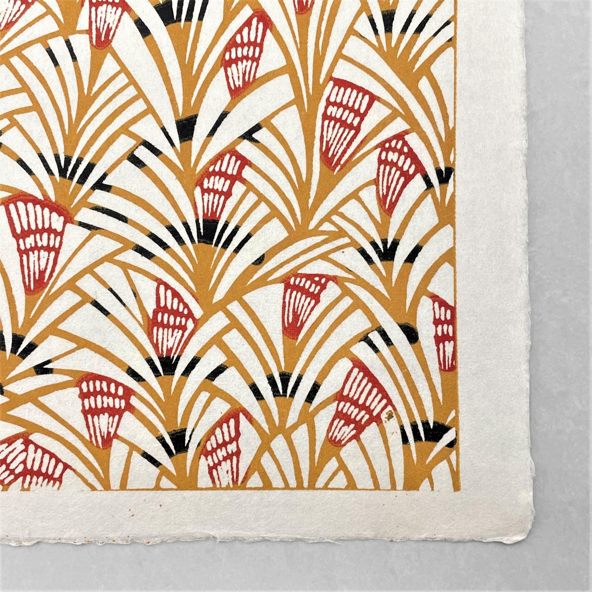 japanese stencil-dyed handmade paper with traditional pattern in mustard and red