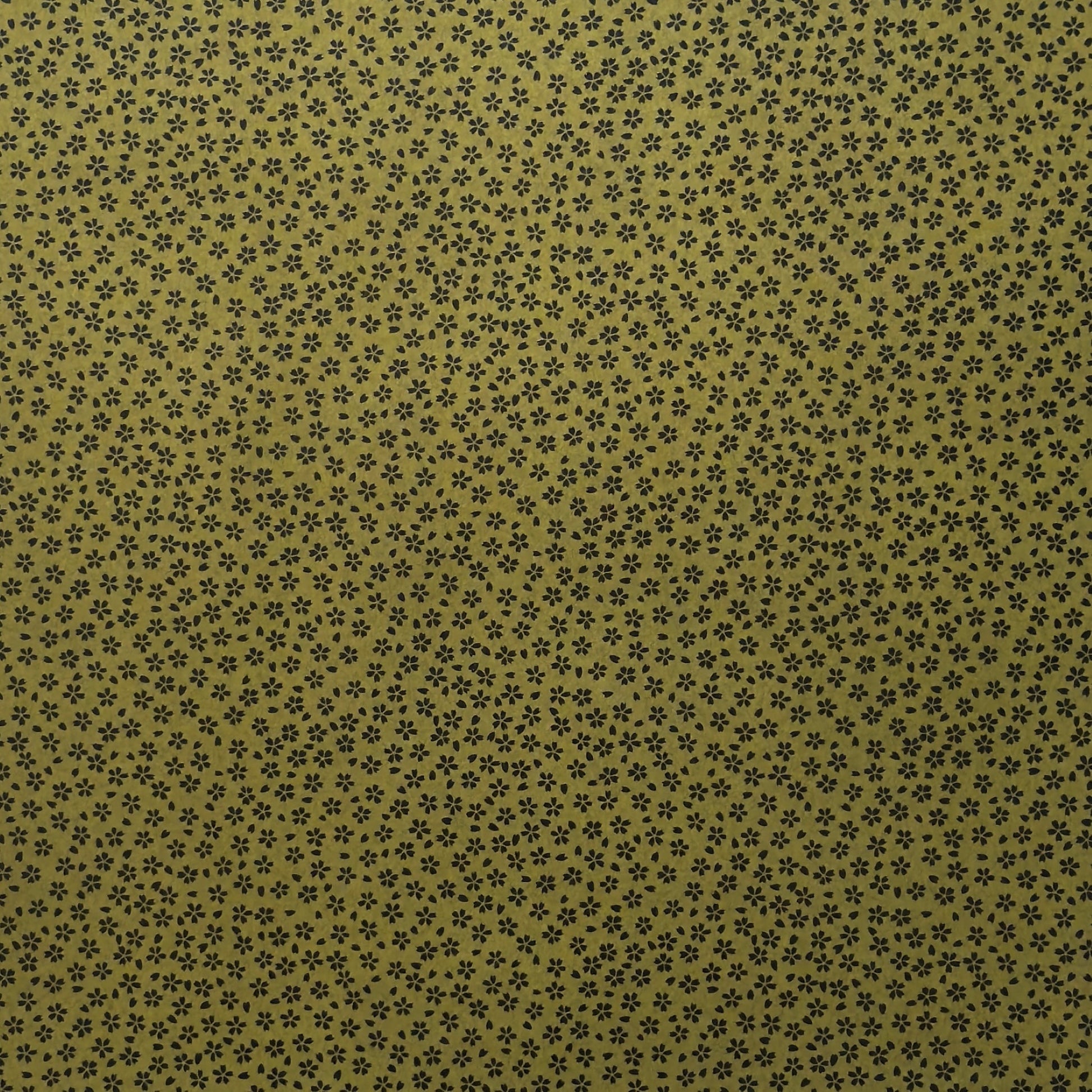 A sheet of Japanese lacquered yuzen paper in dark olive green with little cherry blossom flowers in black