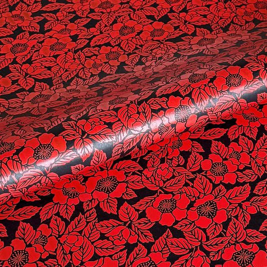 A sheet of Japanese lacquered yuzen paper in black with a red camellia flower pattern