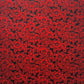 A sheet of Japanese lacquered yuzen paper in black with a red camellia flower pattern