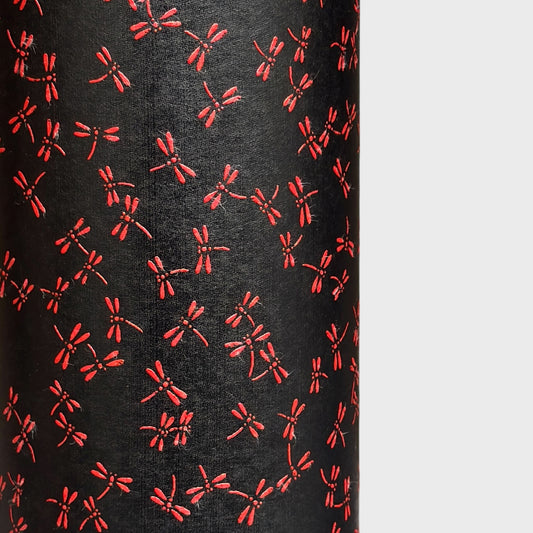 a sheet of Japanese lacquered yuzen paper with black background and little red dragonflies
