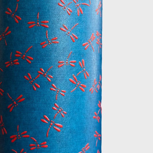 a sheet of Japanese lacquered yuzen paper with blue background and little red dragonflies