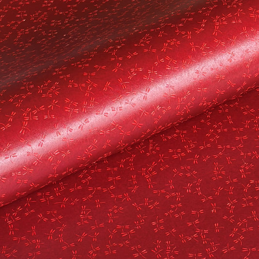 a sheet of Japanese lacquered yuzen paper in bright red background and little red dragonflies