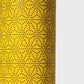 a sheet of Japanese lacquered yuzen paper with a mustard yellow background and a geometric dotted star pattern in black
