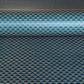 A sheet of Japanese lacquered yuzen paper in deep teal with a repeat small triangle geometric pattern in cream