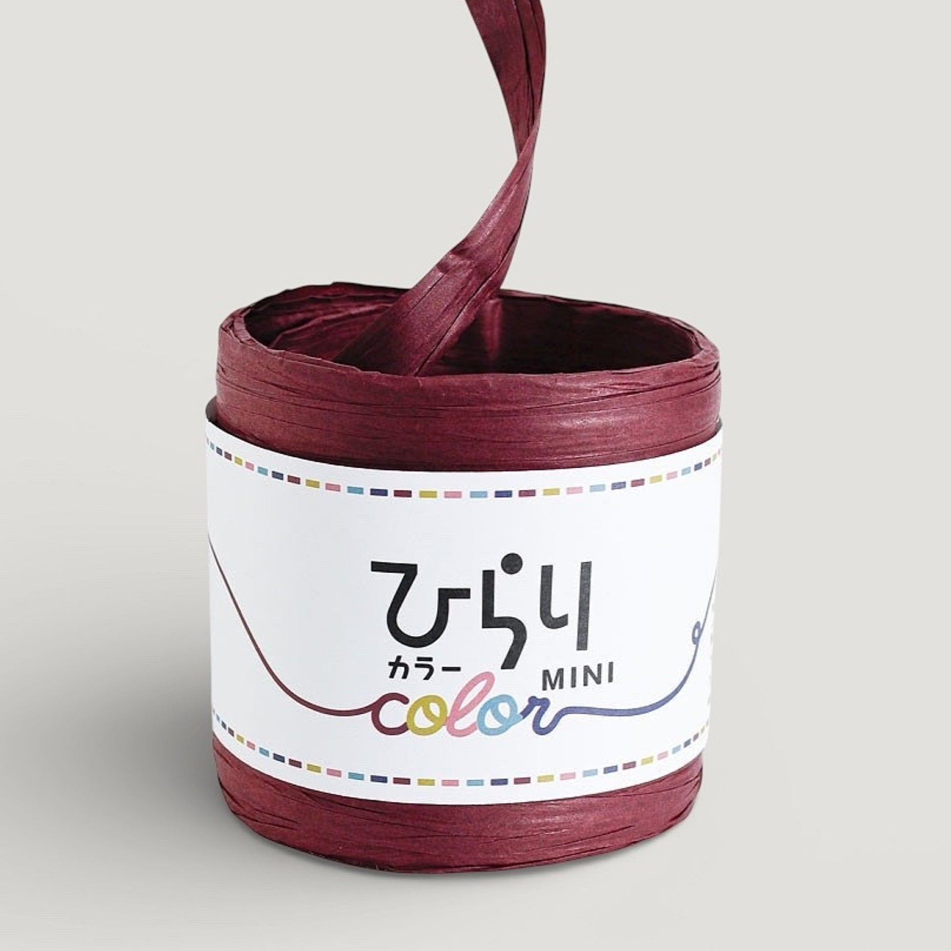 reel of Japanese paper string in wine colour