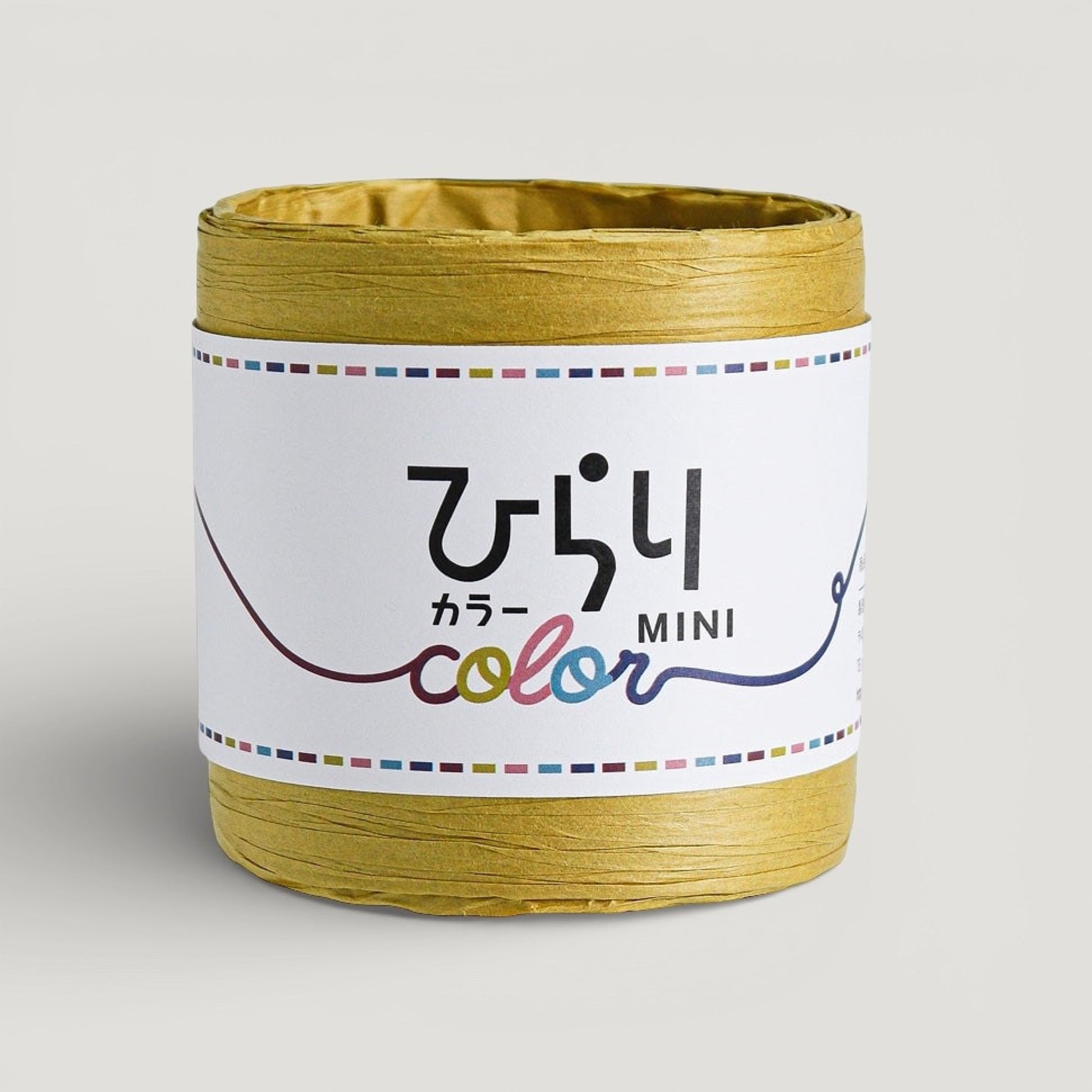 a reel of mustard colour Japanese paper string