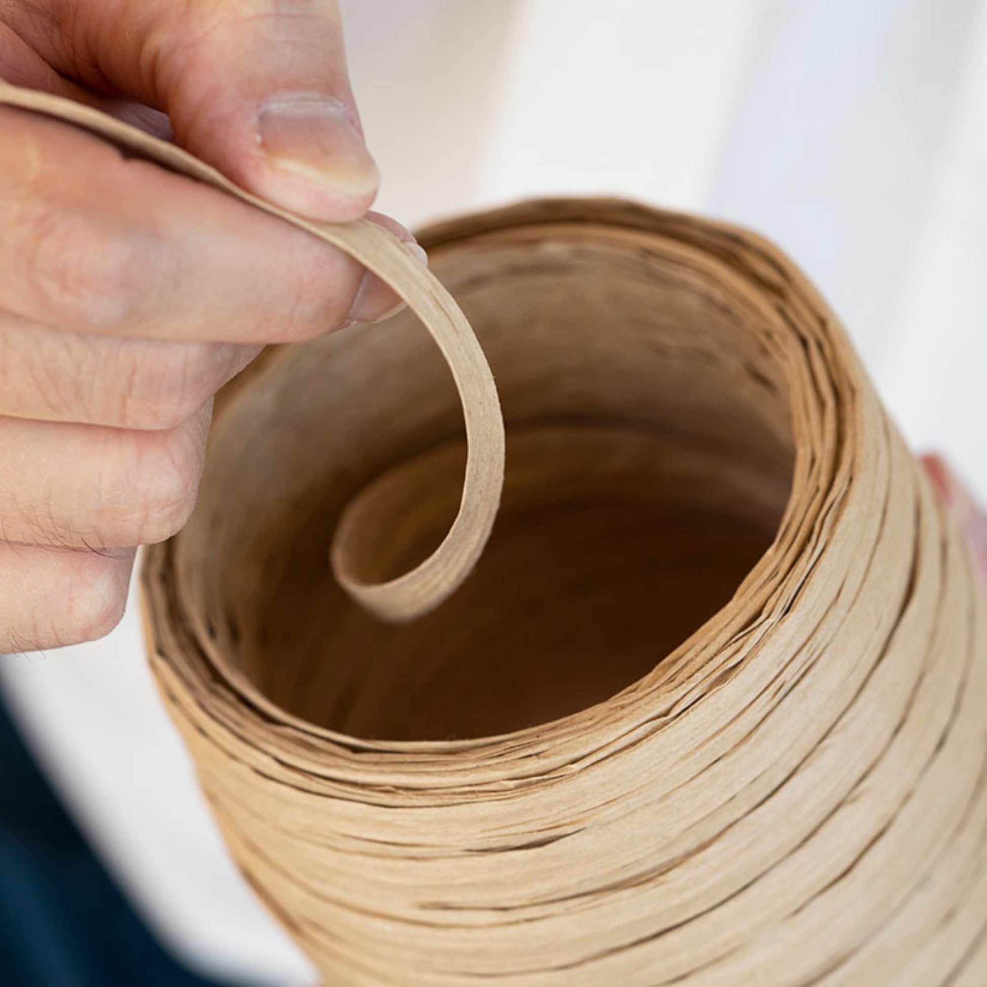 a reel of natural coloured Japanese paper ribbon