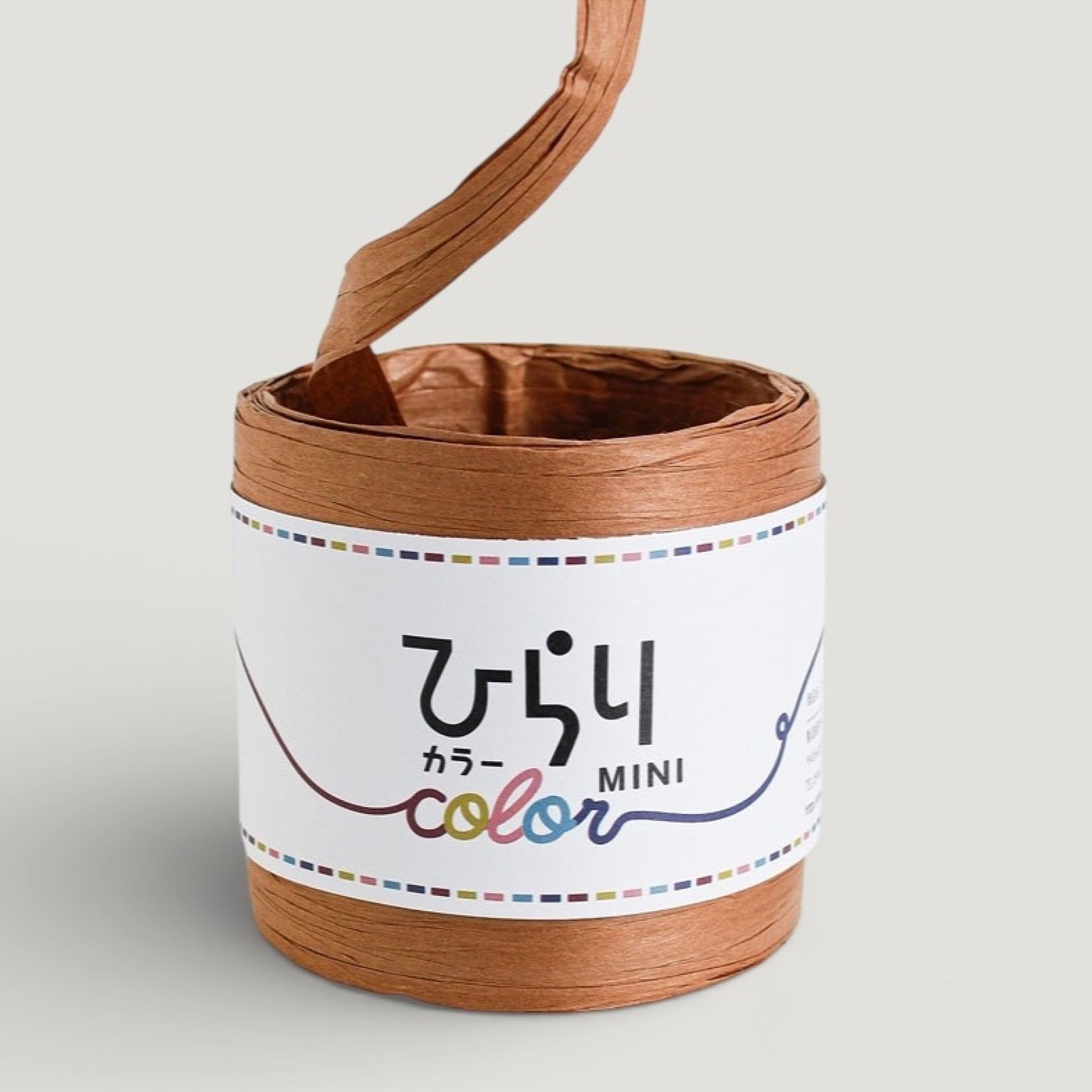 a reel of  tan colour Japanese paper string