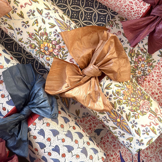 tan coloured Japanese paper string wrapped as a bow