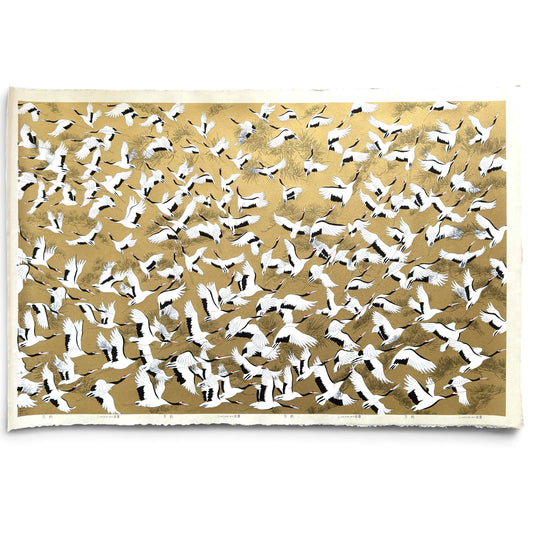 a sheet of Japanese Sogara yuzen paper with an image of white and black flying cranes on a gold background.