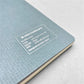 A5 soft cover notebook, cover is grey with a small white grid pattern. by Japanese brand Kleid