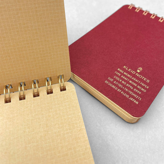 A7 memo ring-bound notepad, cover is plain burgundy with rose-gold dual rings by Japanese brand Kleid