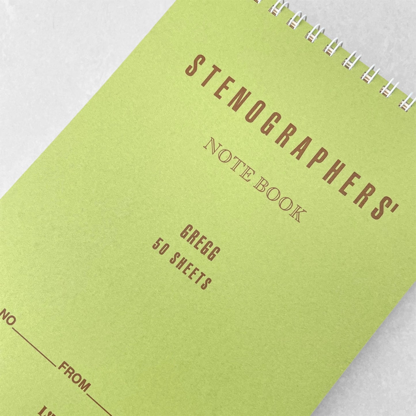 Top ring-bound stenographers' notebook with plain pistachio green cover by Japanese brand Life Japan