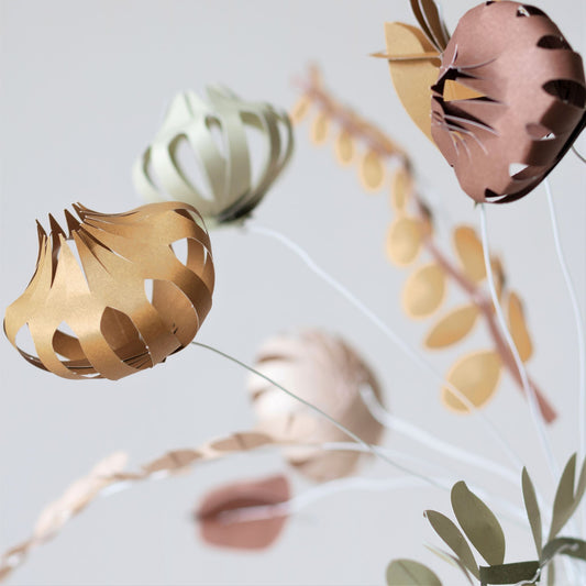 a paper craft kit of 12 paper flowers by Jurianne Matter , close up of the flower heads