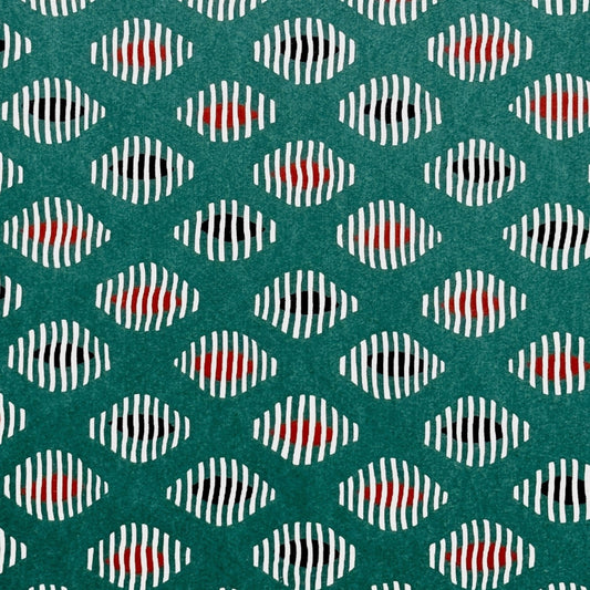 japanese stencil-dyed paper with geometric oval pattern in white, black and red on green background