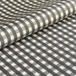 a sheet of wrapping paper with a black and white gingham pattern