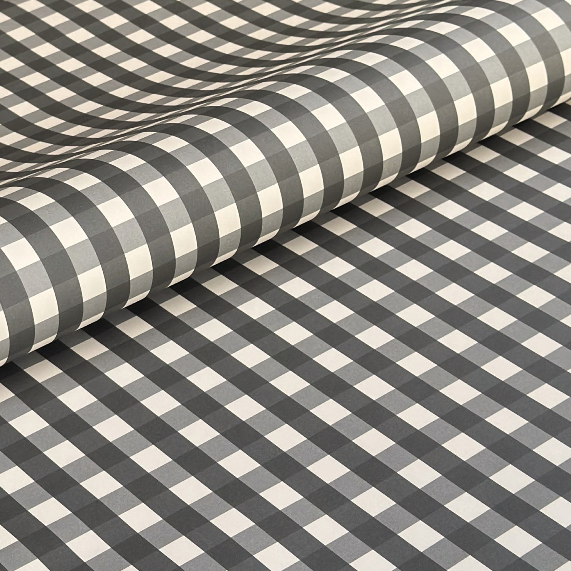 a sheet of wrapping paper with a black and white gingham pattern