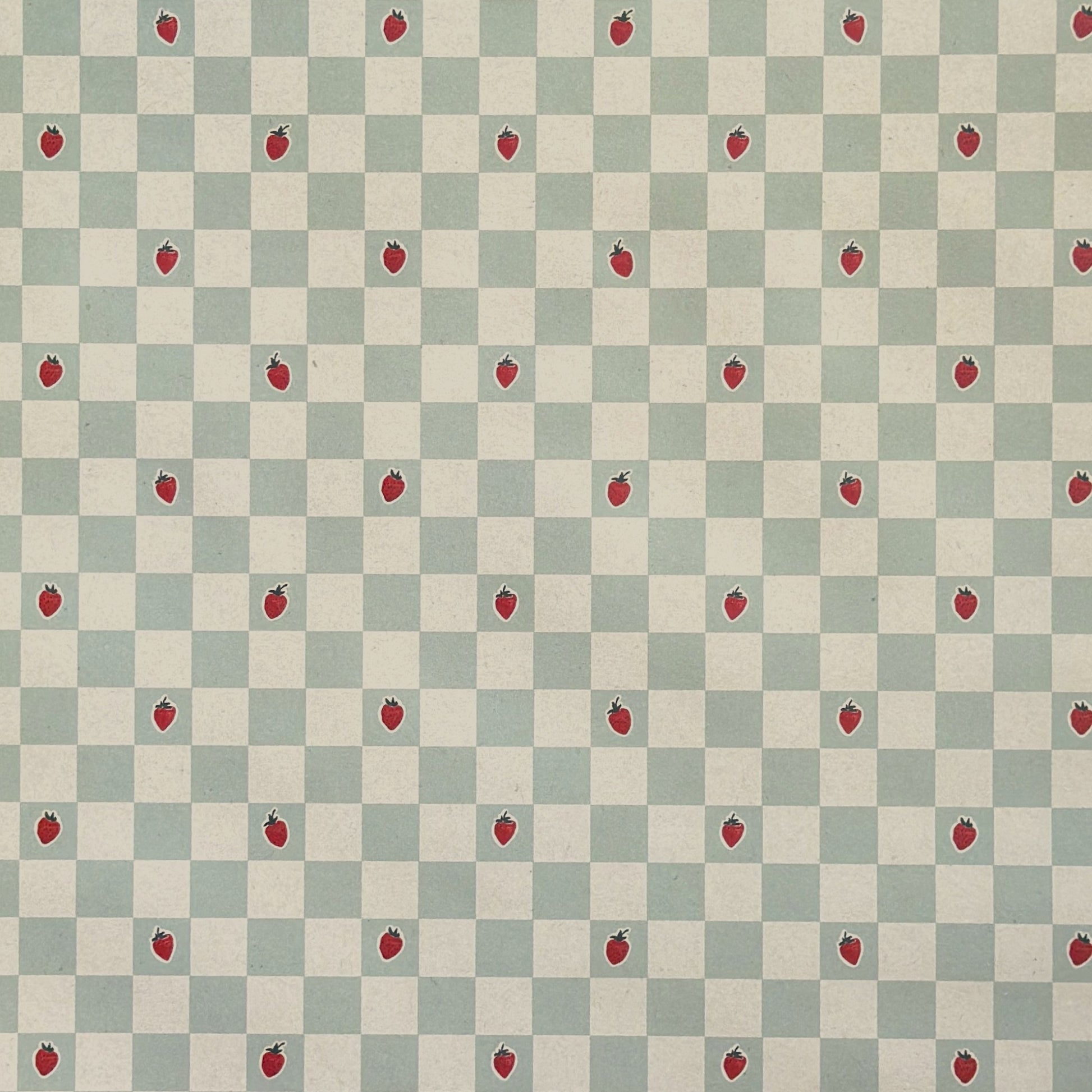 a sheet of wrapping paper with a soft green and cream checkered pattern with vintage style strawberries