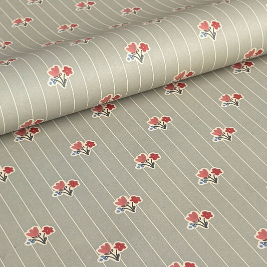 a sheet of wrapping paper with a soft grey-green stripe and pink and red vintage floral flowers
