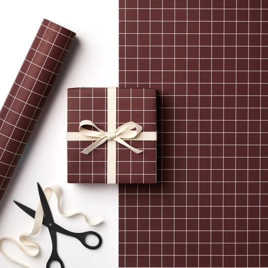 a sheet of wrapping paper in brown with a simple white grid pattern