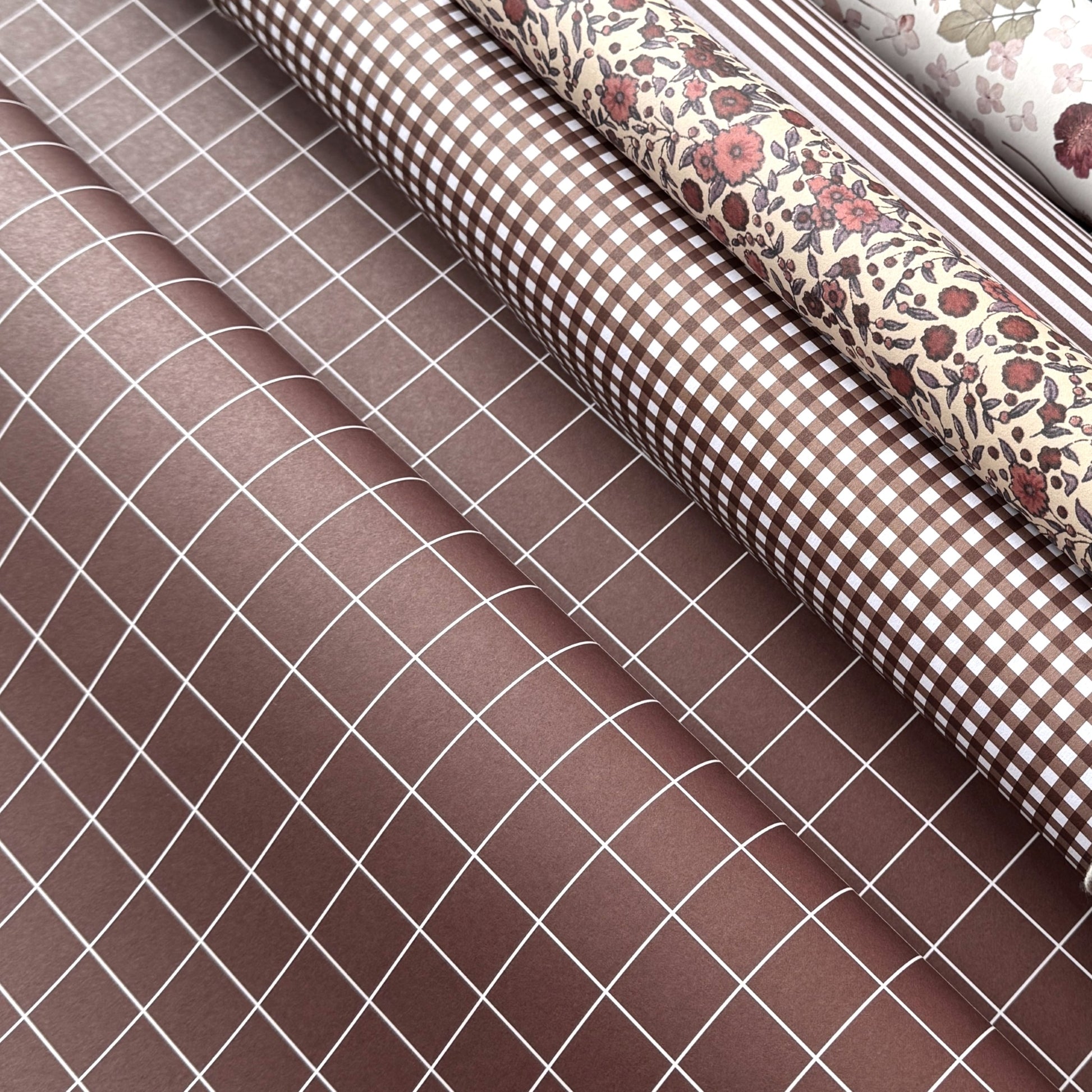 a sheet of wrapping paper in brown with a simple white grid pattern