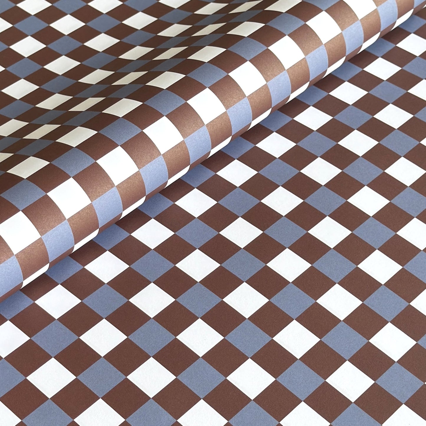 a sheet of checkered wrapping paper in brown, blue and white