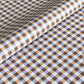 a sheet of wrapping paper with a gingham pattern in brown, beige and light blue