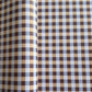 a sheet of wrapping paper with a gingham pattern in brown, beige and light blue