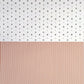 a sheet of wrapping paper with a split design, the top half has little black tile design on white and the bottom half a narrow stripe in cinnamon and white.