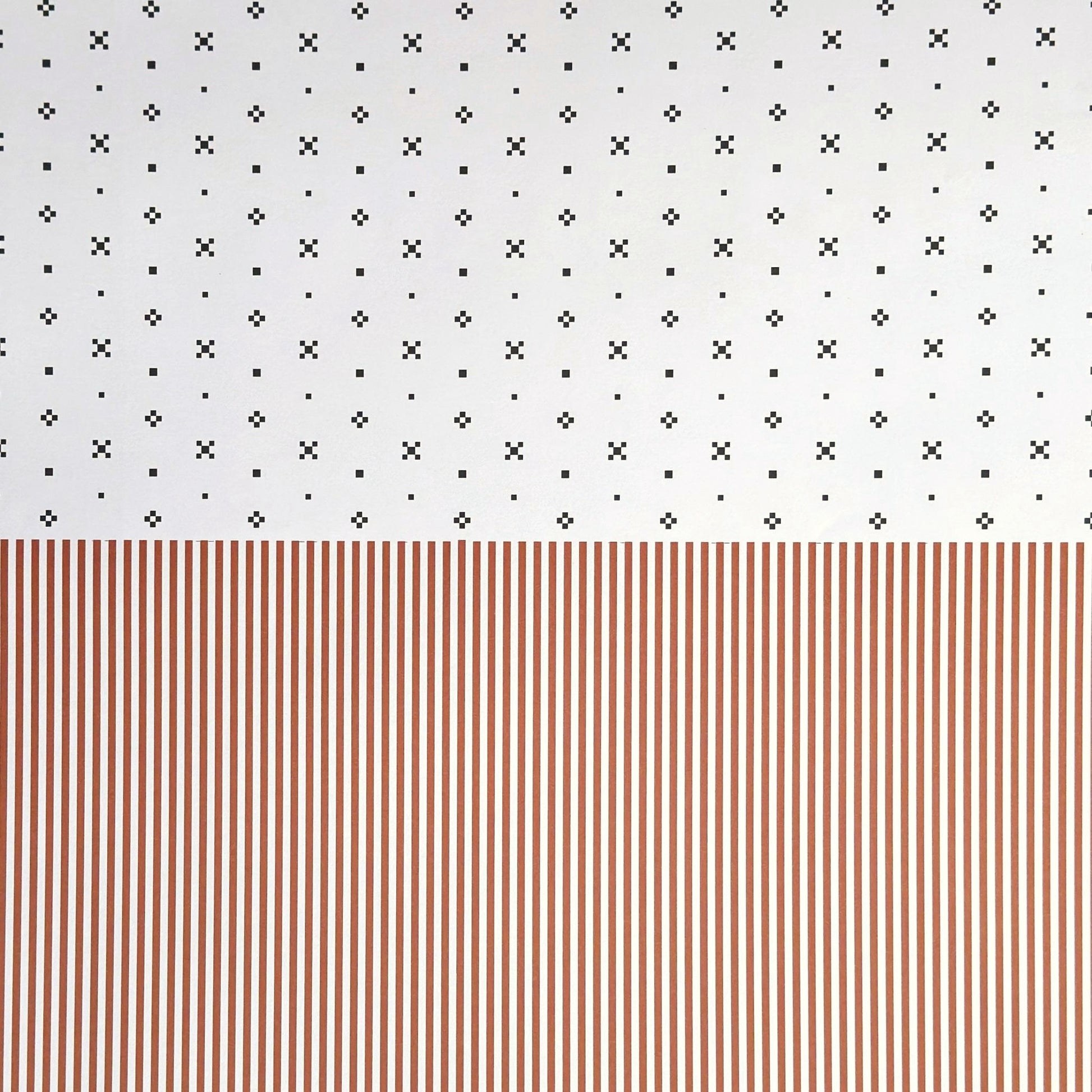 a sheet of wrapping paper with a split design, the top half has little black tile design on white and the bottom half a narrow stripe in cinnamon and white.