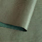 a sheet of Nepalese lokta paper with a lime green and pink grid pattern on dark green handmade paper