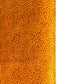 a sheet of screen printed Nepalese lokta paper with a repeat floral design in dark orange on an amber yellow lokta paper 
