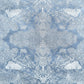 a sheet of Nepalese lokta paper in sky blue with a detailed pattern of trees and flowers screen printed in white