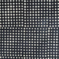 a sheet of black batik dyed Nepalese lokta paper with repeat design of white dots.  