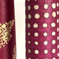 Nepalese handmade decorative lokta paper sheet with a pattern of white dots on burgundy red lokta paper.  Batik dyed using carved wooden blocks.