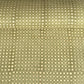 a sheet of Nepalese batik lokta paper in sage green with a repeat white dot design. 