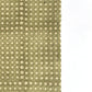 a sheet of Nepalese batik lokta paper in sage green with a repeat white dot design. close up