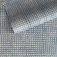 a sheet of Nepalese batik lokta paper in sky blue with a repeat white dot pattern. 