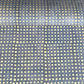 a sheet of Nepalese batik lokta paper in sky blue with a repeat white dot pattern. 