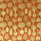 a sheet of screen printed Nepalese lokta paper in terracotta brown with gold trees.  