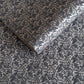 Nepalese handmade decorative lokta paper sheet with a black floral pattern screen printed on a dark taupe lokta paper.