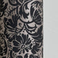 Nepalese handmade decorative lokta paper sheet with a black floral pattern screen printed on a dark taupe lokta paper.