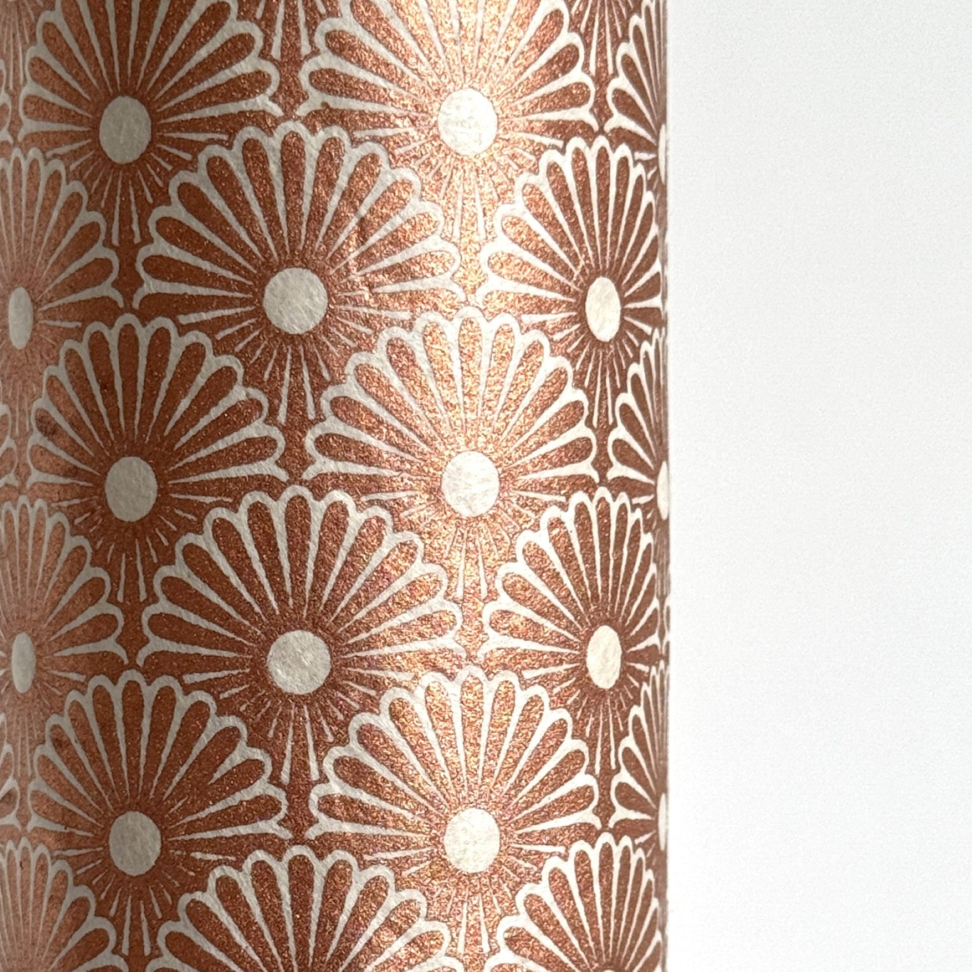 Nepalese handmade decorative lokta paper sheet with a copper metallic repeat floral pattern screen printed on an ivory lokta paper.