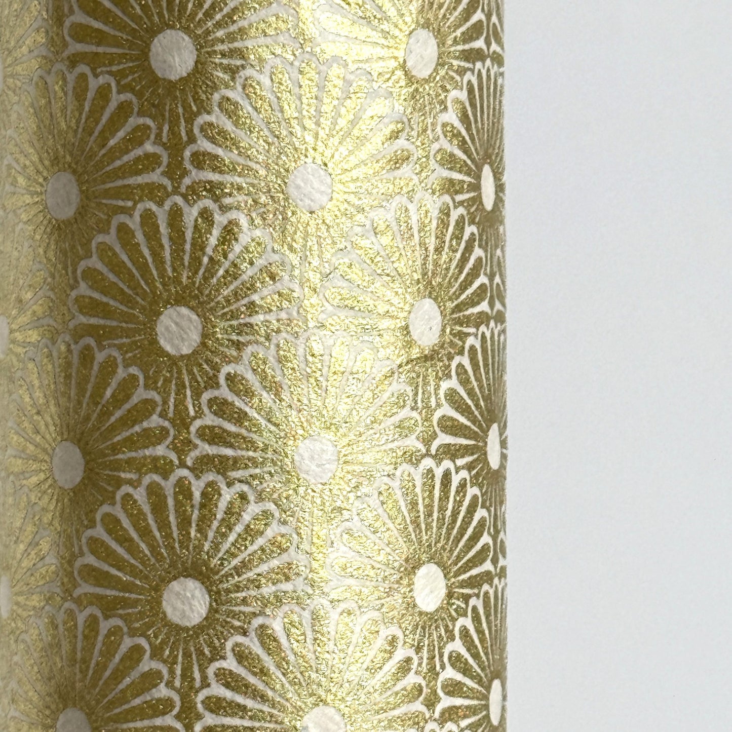 Nepalese handmade decorative lokta paper sheet with a gold metallic repeat floral pattern screen printed on an ivory lokta paper.