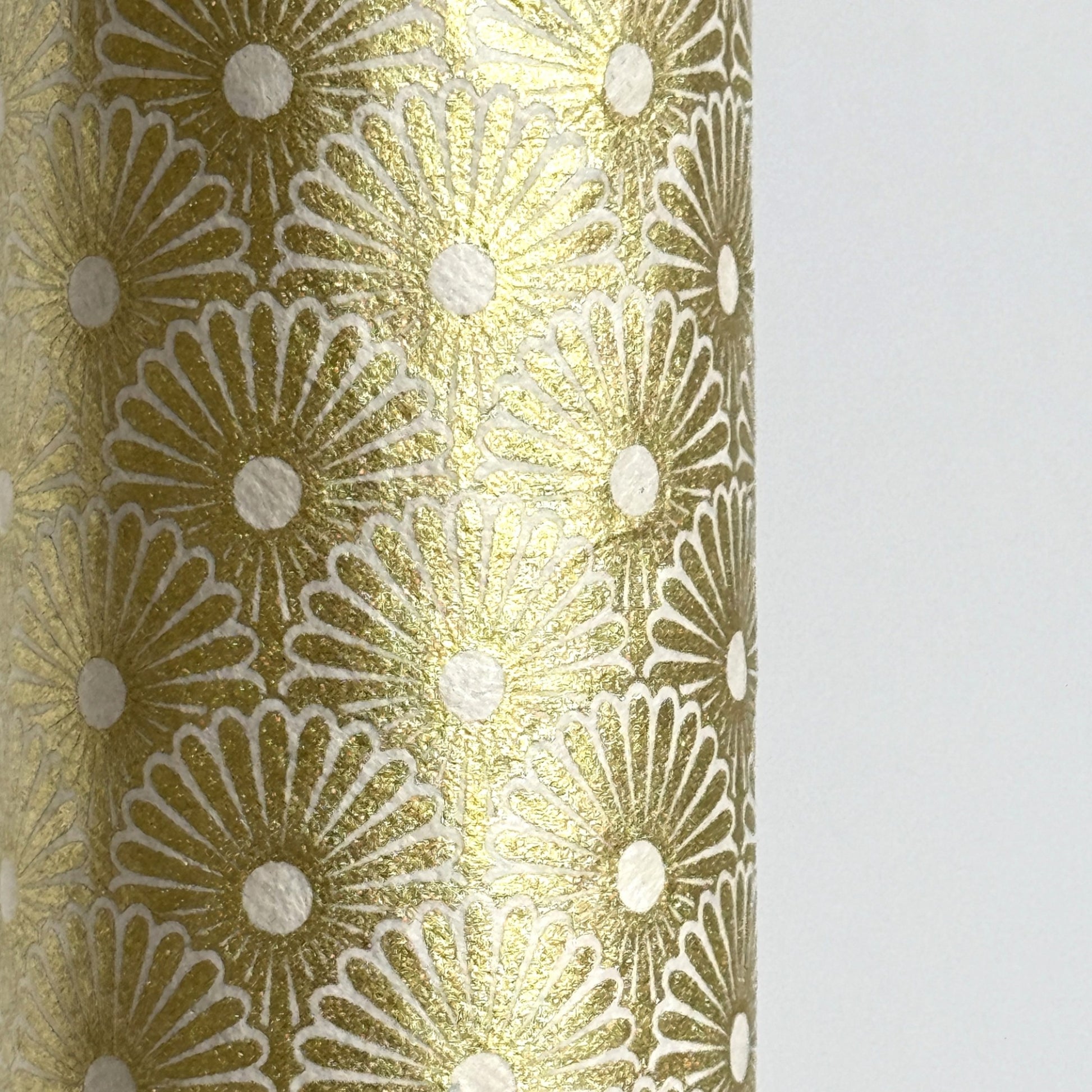 Nepalese handmade decorative lokta paper sheet with a gold metallic repeat floral pattern screen printed on an ivory lokta paper.