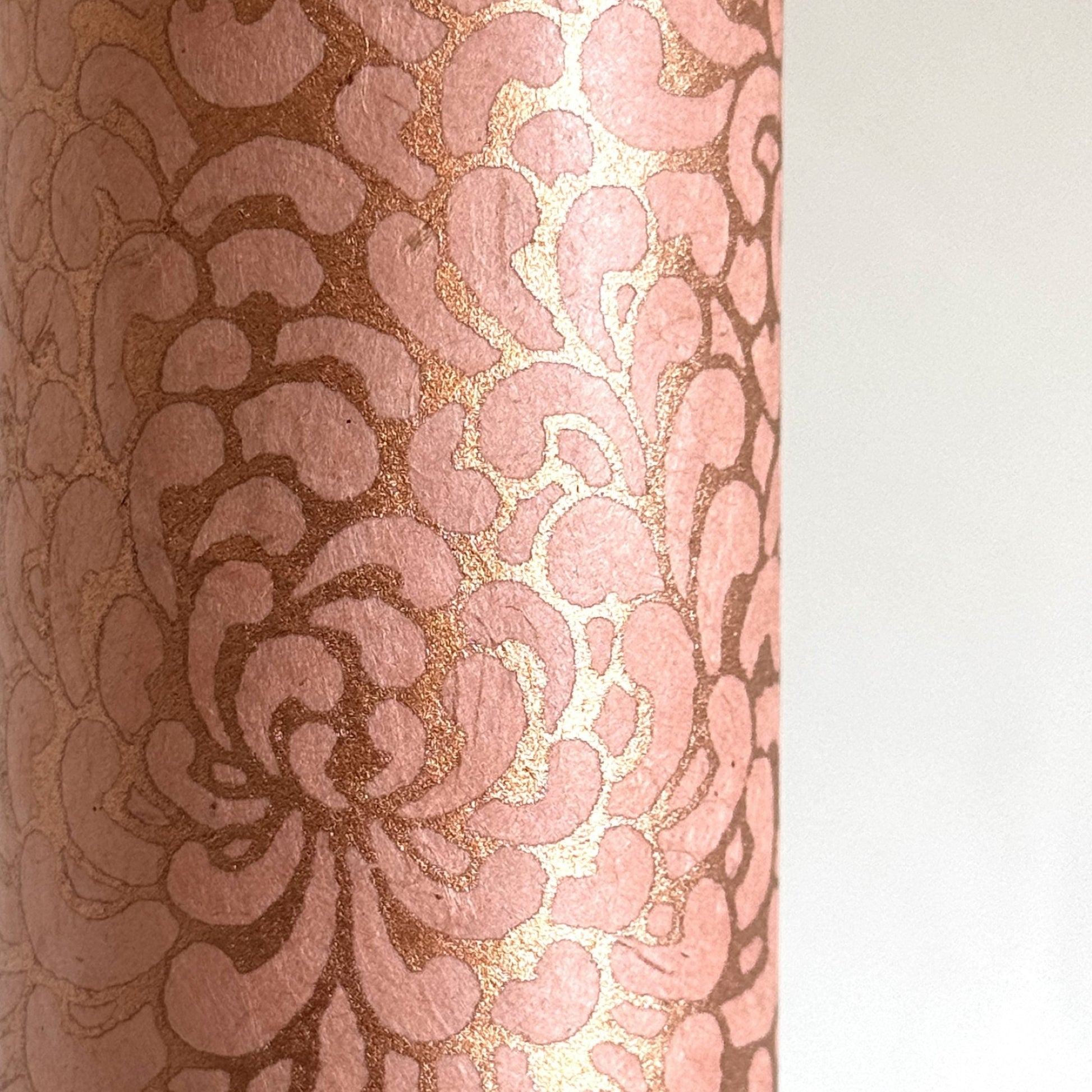 Nepalese handmade decorative lokta paper sheet with a metallic copper floral print screen printed on a blush pink lokta paper