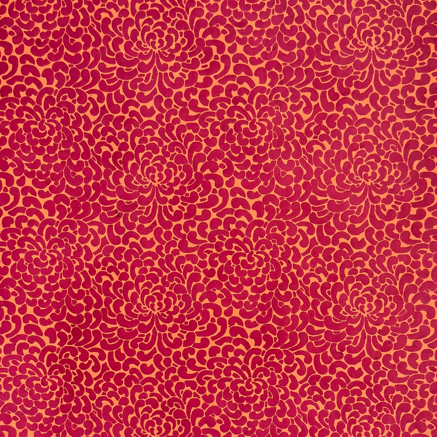 Nepalese handmade lokta paper sheet with a screen printed coral floral design on fuchsia lokta paper