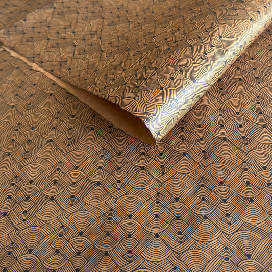 Nepalese handmade decorative lokta paper sheet with a fine lined black knots pattern screen printed on a brown lokta paper.