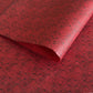Nepalese handmade decorative lokta paper sheet with a fine lined black knots pattern screen printed on a red lokta paper.